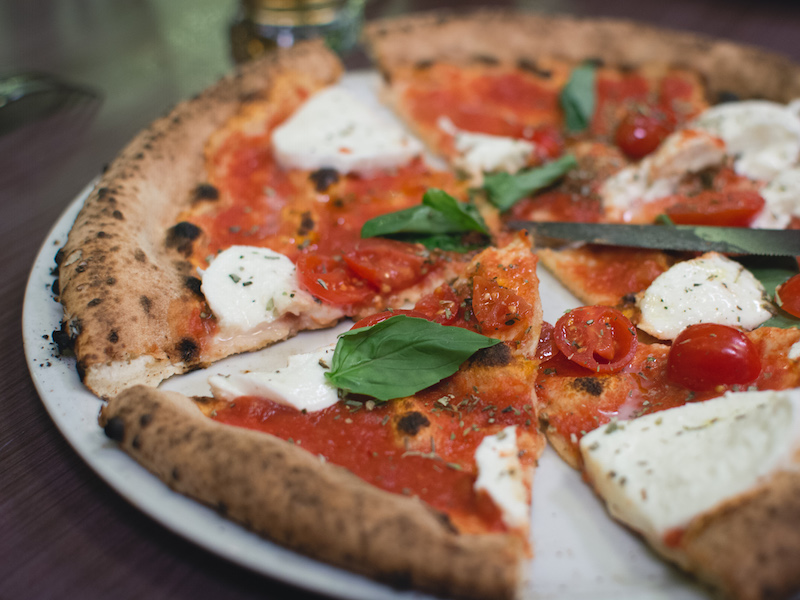 Simple italian pizza with cherry
              tomatoes